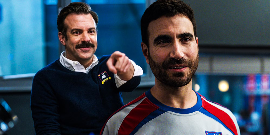 Ted Lasso points at a smiling Roy Kent